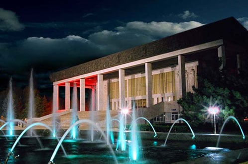 columned building at night with fountains