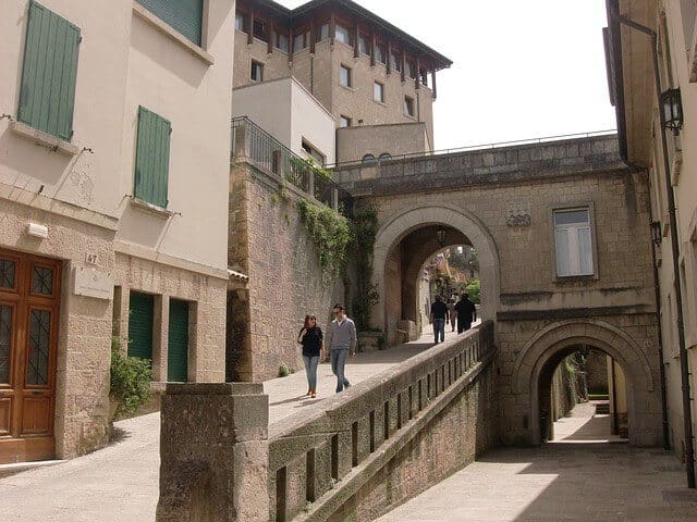 man and woman on san marino tour walking medieval streets