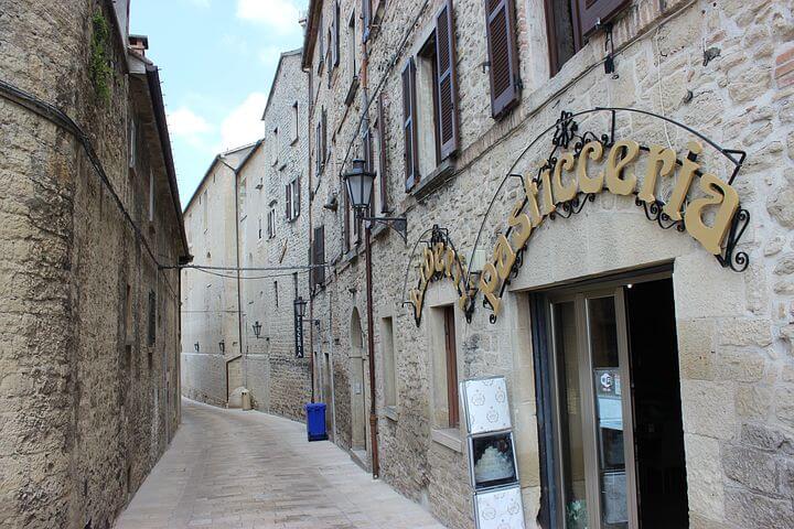 empty street on san marino tour with brick buildings on each side