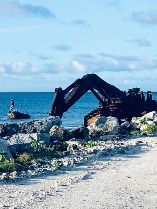 rusting backhoe on ocean edge of Ebeye island