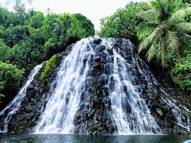 Kepirohi waterfall on Pohnpei Micronesia with green trees around