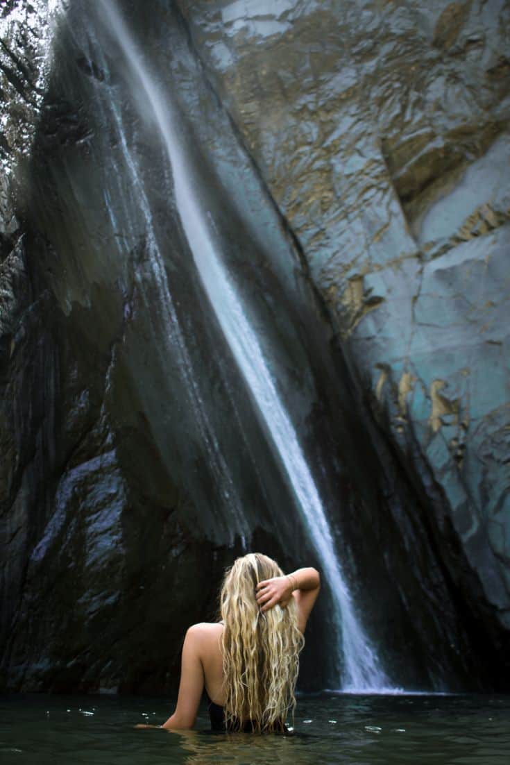 Los Tres Ojos National Park woman by waterfall