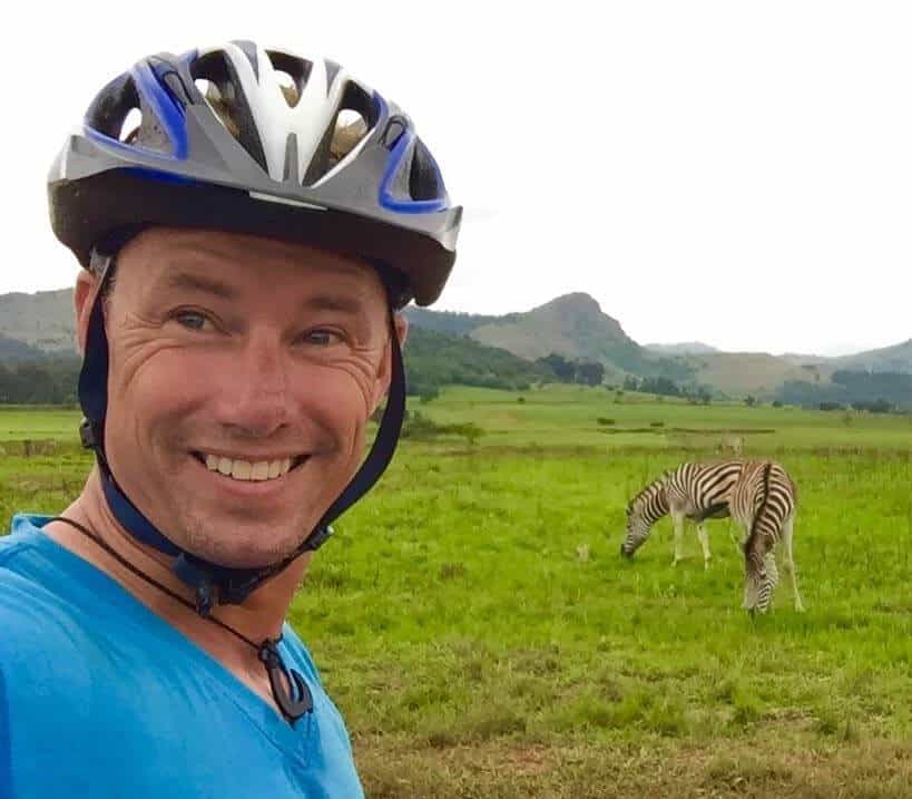 two zebra and man in Mlilwane Wildlife Sanctuary