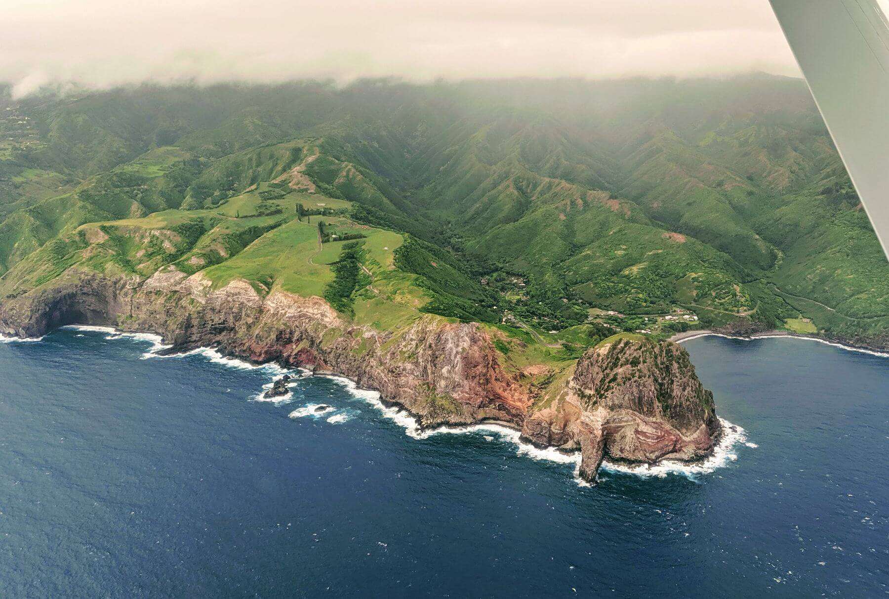 west maui mountains green and brown cliffs to ocean