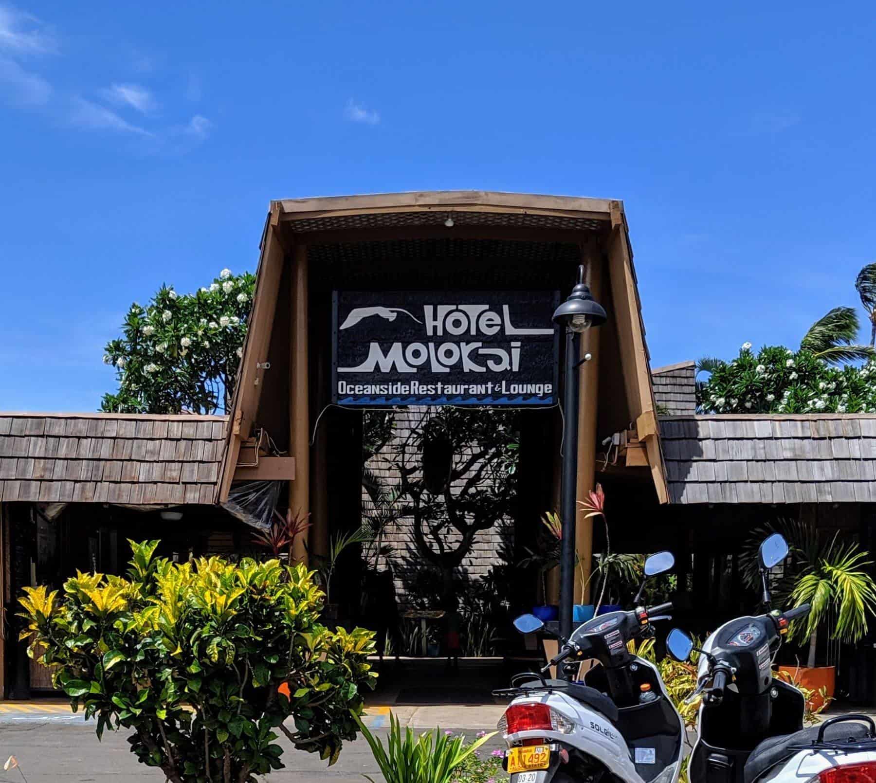 hotel molokai entrance with two white mopeds