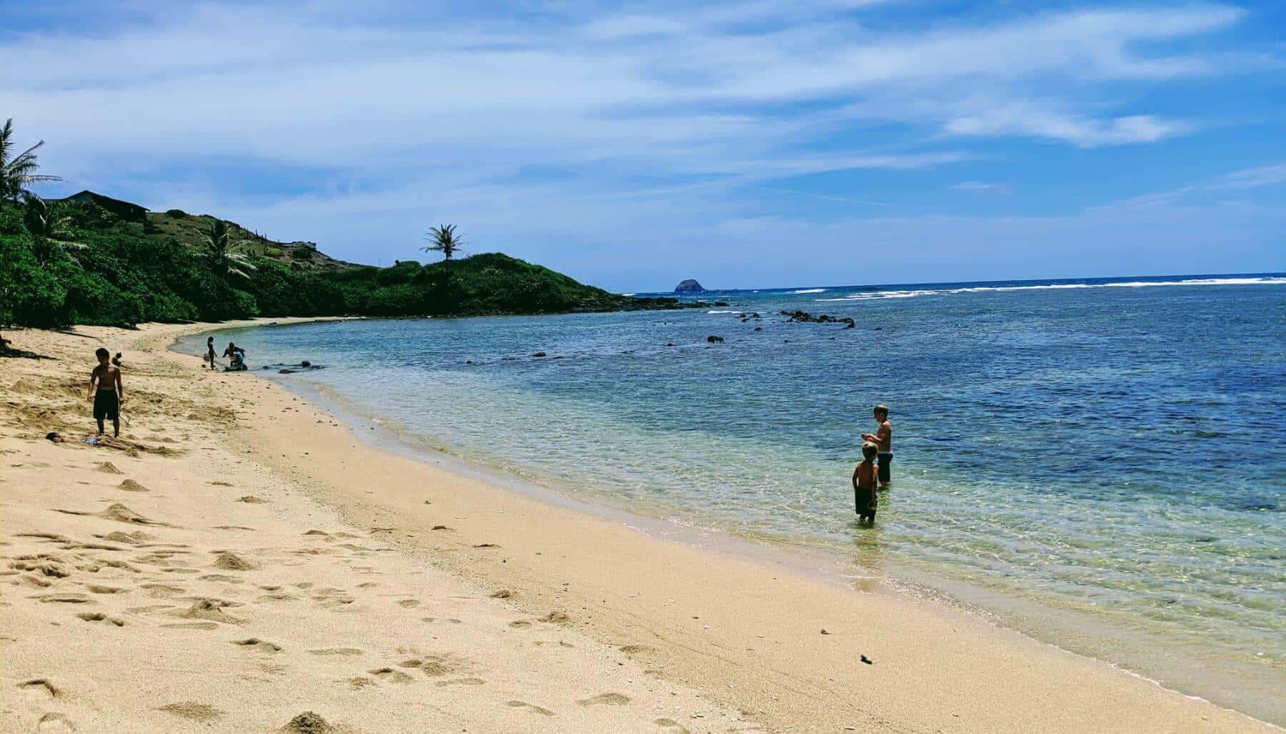 molokai beach and ocean with six kids in water