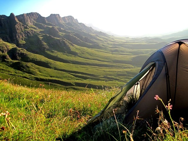 tent next to green Drakensburg mountains