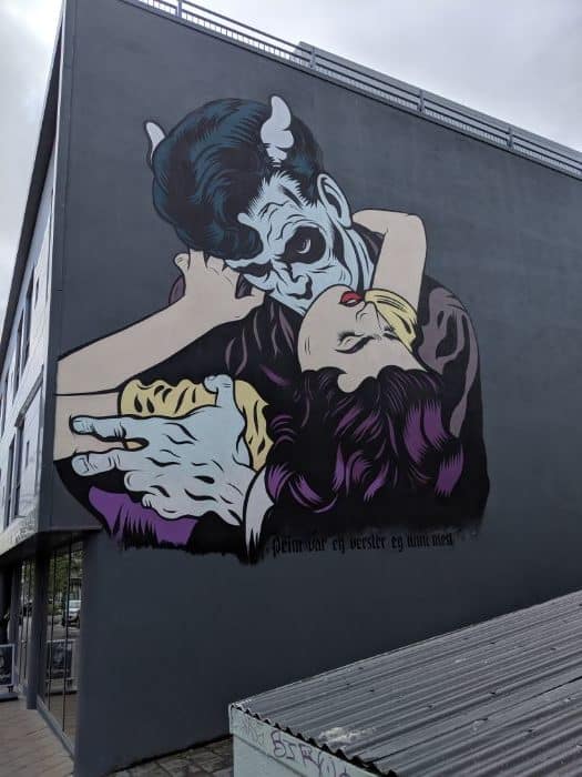 ghoul kissing woman painted on side of building in Reykjavik