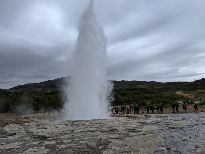 Geysir erupting by people