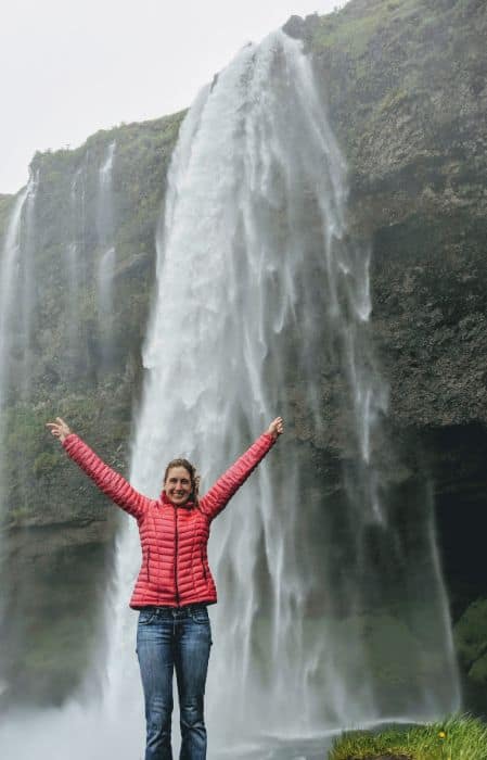 woman in front of Seljalandsfoss Waterfall